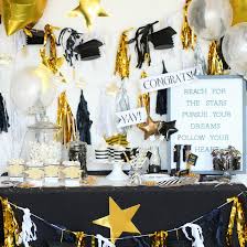 Choose stylish ornaments for your tables and walls; Graduation Dessert Table Fun365