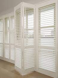 Made of real or faux wood, interior window shutters offer a thicker, more substantial structure that rests inside the interior sill. Blinds For Bifold Doors Bifold Window Bifold Doors