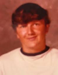 Adding 1978 graduate's name to the wall