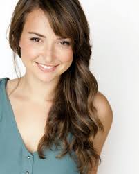 Milana Vayntrub is a versatile American actress, comedian, and activist,  best known for her role as Lily Adams in a series of popular AT&T  commercials that showcased her comedic talent and charm.