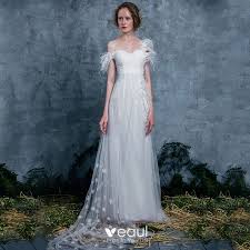 Just plan your undergarments accordingly! Modern Fashion Ivory Summer Wedding Dresses 2018 Empire One Shoulder Short Sleeve Backless Appliques Flower Feather Ruffle Watteau Train