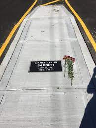 At each end of the grave is a divided highway sign with a cross in the center, indicating a cemetery. Nancy Kerlin Barnett 1793 1831 Find A Grave Memorial