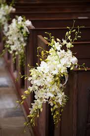 Especially if you're unable to add décor inside the church, consider decorating the outside with garlands of flowers, add wreaths to doors, or display large urns filled with blooms at the entrance. Pew Flowers Wedding Off 71 Buy