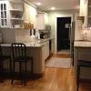 Kitchen overlooks family room which also boasts a gas fireplace w/beautiful stone hearth. 1