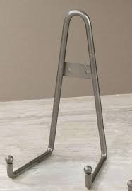 This plate holder stand is constructed from sturdy wrought iron to provide a classic, rustic accent for your kitchen that will endure for years and years to come. Plate Stand Plate Stands Plate Easel Plate Easels Fine Home Displays