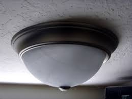 Three sets of wires, each held together by a red wire connector. How To Install And Wire A Light Fixture At Home Dengarden