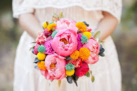 The arbor was decorated with colorful and whimsical paper flowers and papel picado banners were strung from the trees. Dia De Los Muertos Wedding Inspiration Green Wedding Shoes