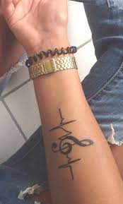 Female tattoos are as badass as they are classy, and it's never too late to get inked. Black Music Note Forearm Tattoo Ideas For Women Small Treble Clef Designs Arm Tat Ideas De Tat Tattoos For Women Small Music Tattoo Designs Trendy Tattoos