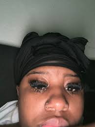 Removing black lash bond from faux suede hat?