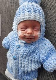 Family keep tiny baby Finlay Mackenzie safe at home after miracle birth