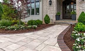 The mosaic path's colors are repeated. Creating Warm Welcomes With Front Entrances And Walkways Unilock