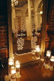 An Intimate Wedding In Los Angeles California Mirror Seating Chart Seating Chart Wedding Seating Plan Wedding