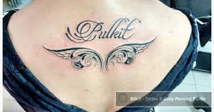 Name in script with black and grey angel wings chest. Wings Tattoo With Name Wings Tattoo Tattoos Name Tattoos