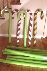 Pool Noodle Candy Canes Made With Pool Noodles Wire Hangers Make Straight Wir Pool Pool Noodle Christmas Wreath Candy Cane Crafts Candy Cane Decorations