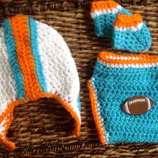 About 30 x 24 hand tied edges back is red fleece, shad. Crochet Miami Dolphins Theme Football From Kardsandgifts On Etsy
