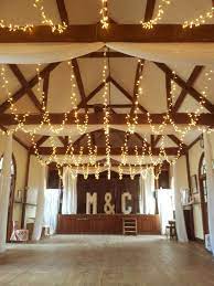 Wedding Lights In A Village Hall Fairy Light Canopy And Curtain Drapes For A Total Transformat Wedding Hall Decorations Wedding Backdrop Lights Wedding Lights