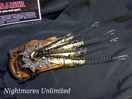 Freddy krueger in a combo of two of his iconic looks: Custom Made Freddy Glove Has A Badass Hellraiser Twist Bloody Disgusting