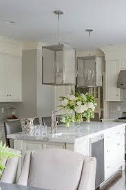 Ivory Kitchen Island With Nickel And Mesh Lanterns Transitional Kitchen Ivory Kitchen Interior Design Kitchen Painted Kitchen Cabinets Colors