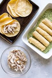 We rounded out the flavor of the tomatillo sauce with onion, garlic, cilantro, and lime juice. Creamy Poblano Chicken Enchiladas Girl Gone Gourmet