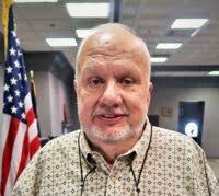 Coroner faces federal charges for theft of guns, ammo