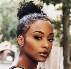 Use a comb to straighten out any lumps or bumps in the hair. Curly High Bun Hairstyles For Black Hair Novocom Top