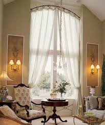 You can have regular rods and curtains and cover the window. Arched Window Treatment Ideas Better Homes Gardens