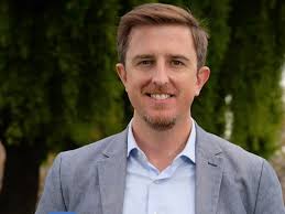 Gay candidate Trevor Chandler was attacked while knocking