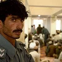 Provincial Gov. Asraf Mohammad Naseri presents a token