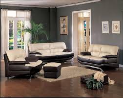 Living Room Cream And Black Leather Sofa On Brown Wooden Floor Connected By White Curtains On Brown Living Room Living Room Decor Gray Brown Living Room Decor