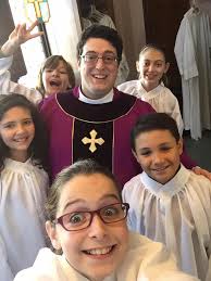 Kids serving as altar servers at church