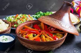 Keep stirring so the couscous won't stick to the pan. Moroccan Food Traditional Tajine Dishes Couscous And Fresh Salad On Rustic Wooden Table Tagine Chicken Meat And Vegetables Arabian Cuisine Stock Photo Picture And Royalty Free Image Image 119265992
