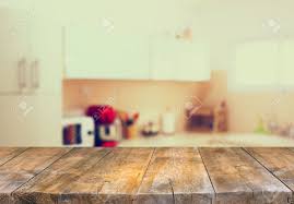 Dining at the bachelor pad never looked better. Empty Table Board And Defocused White Retro Kitchen Background Stock Photo Picture And Royalty Free Image Image 41226441