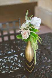 Gold bottle table centerpieces, metallic gold wine bottle decor, customizable. Diy Gold Wine Bottle Table Centerpieces