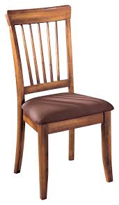 A curvaceous profile and nailhead trim along the upholstered back enhance this chair's flair. Berringer Dining Room Chair By Ashley Furniture Nis778318257 Callan Furniture