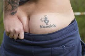 Want to discover art related to dumbfoundead? This Week In Unfortunate Food Tattoos International Edition Teen Gets The Nando S Chicken Mascot On His Butt First We Feast