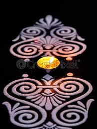 top angle view potrait of glowing diya and white rangoli stock photo crushpixel top angle view potrait of glowing diya