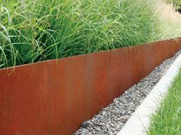 The top portion serves as a defining line to hold back your mulch, gravel or soil. Corten Steel Edging Durable Rustic Garden Edging