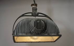 Ceiling lamps hang from the ceiling, especially at the center or opposite sides. Large Industrial Ceiling Light Fixture For Sale At 1stdibs