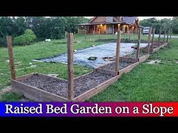 Let's find a solution for your sloping yard that really works for your lifestyle, then discuss how to build a garden around it. Building Raised Beds Down A Slope Fenced In Garden Area Part 3 Youtube