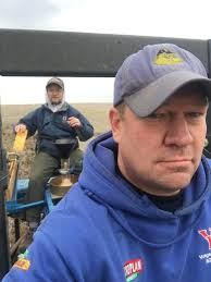 Dr Karl Glover (back), SDSU Spring Wheat Breeder, and Jonathan Kleinjan  (front), SDSU Crop Performance Testing Director, team up to plant spring  wheat test plots near Agar SD