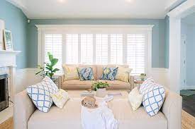 Beige and brown living room decor is well adapted for areas with lots of natural light. Beige And Blue Living Room With Wainscoting Transitional Living Room