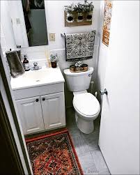 This minimal, rustic bathroom makes the best out of the least amount of decor possible, with a wooden ladder for the towels, a concrete floor, and open wood vanity. 10 Small Apartment Bathroom Decor Ideas And Decorating Tips Alley Corner Nordic Wall Decor Home Decor