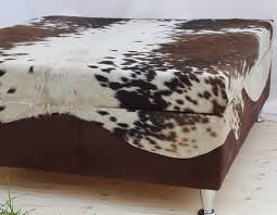 Fabulous genuine cowhide upholstered large square ottoman on bulbous legs and brass casters, looks great as a low coffee table. Extra Large Storage Cowhide Footstool Ottoman Coffee Table Etsy