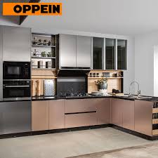 In an effort to add more light to the space, the ceiling is covered in a textured orange wallpaper. China Oppein Metal Color L Shape Modern Kitchen Designs For Small Kitchens China Kitchen Designs Modern Kitchen Designs