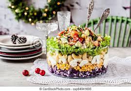 Cook the pasta according to the box's instructions and you want every single bite of this salad to be totally balanced, if you chop your produce too small the pasta will overwhelm all of the delicious flavors. Layered Christmas Pasta Salad With Red Cabbage Corn Tomato Cucumber Cheese Bacon And Herbs Canstock