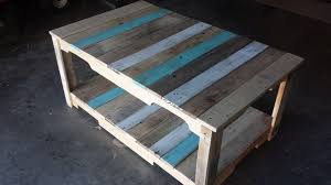 The wood left is not whetted and gives a rough style. Pallet Coffee Table With Stained Stripes Easy Pallet Ideas