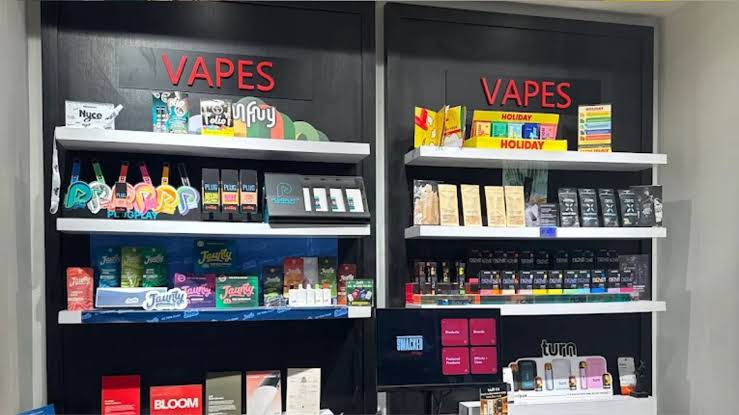 High-end hardware display featuring pods, coils, and dry herb devices in an NYC store., AI generated
