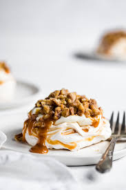 Soft And Pillowy Caramel Swirled Mini Pavlova Cakes With Cheesecake Mousse Salted Caramel Sauce And Chopped Glazed W Pavlova Cake Pavlova Recipe Mini Pavlova