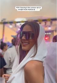 Dancing in the Summer Rain at a Music Festival