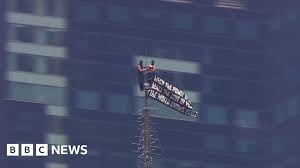 Two people climb to top of NYC's Empire State Building